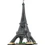 Vollständiger LEGO Eiffelturm mit Gitterwerk-Metallstruktur, vier Bogenbeinen und kleinen grünen Bäumen am Fuß