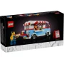 LEGO 40681 Verpackung mit blau-weißem Food-Truck mit rot-weiß gestreifter Markise, Verkäufer und Kunde auf schwarzem Hintergrund
