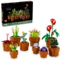 Vue d'ensemble de 9 plantes miniatures LEGO dans des pots marron : cactus, succulentes, fleurs rouges et violettes avec la boîte produit