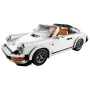 Modèle LEGO Porsche 911 blanc décapotable avec intérieur orange et noir, phares ronds et jantes emblématiques sur fond blanc