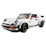 Porsche 911 LEGO blanche vue de trois-quarts avant, phares ronds, intérieur détaillé avec sièges marron et orange