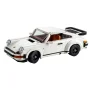 Porsche 911 LEGO blanche avec aileron arrière, phares ronds, intérieur marron et jantes noires sur fond blanc