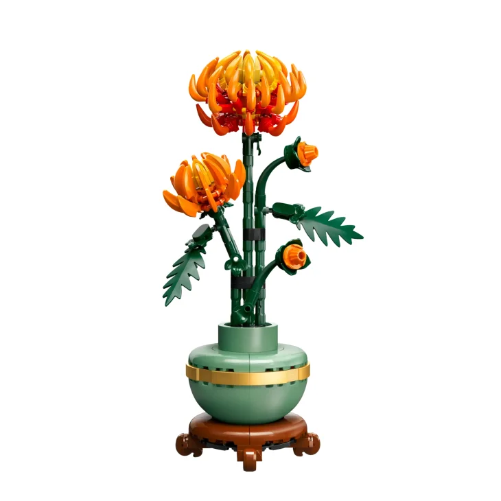 LEGO orange chrysanthemums in green celadon vase on wooden stand, with green stems and detailed foliage