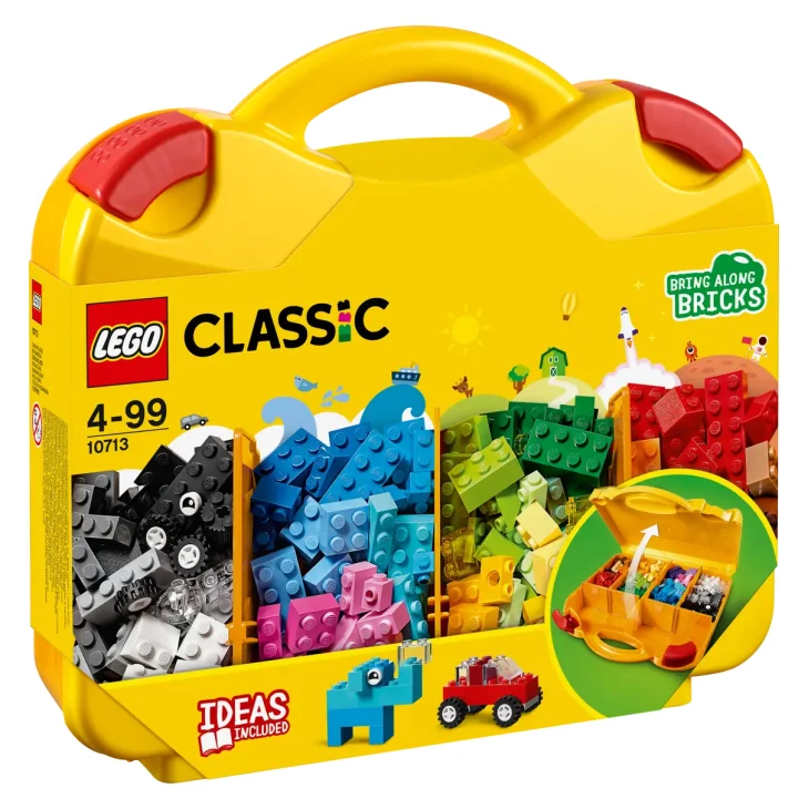 Yellow LEGO Classic suitcase with red handle, displaying colorful bricks and building examples including car and elephant