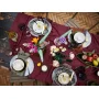 Overview of colorful LEGO bouquet with pink roses, yellow gerberas and green foliage on set dining table