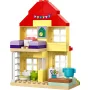 Yellow LEGO house with red roof, colorful bunting, green clock, purple birthday cake and kitchen area on ground floor Yellow LEGO house with red roof, colorful bunting, green clock, purple birthday cake and kitchen area on ground floor