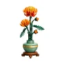 LEGO orange chrysanthemums in green celadon vase on wooden stand, with green stems and detailed foliage