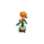 Orange LEGO chrysanthemum flowers in light green vase on brown base with detailed green leaves