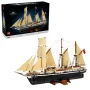 LEGO Endurance ship model with beige sails unfurled, black hull and brown details, displayed alongside its box