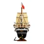 Complete view of LEGO Endurance ship with black hull, deployed beige sails, detailed masts and red flag on white background