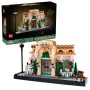 LEGO Parisian café with pink and green facade, terrace, street lamp and minifigures, displayed with its box
