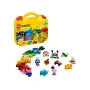 Yellow LEGO Classic suitcase opened with colorful bricks and builds: house, car, boat, dinosaur and minifigure Yellow LEGO Classic suitcase opened with colorful bricks and builds: house, car, boat, dinosaur and minifigure