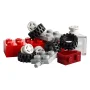 Collection of colorful LEGO pieces: red and gray bricks, white wheels, black tires and technical elements on white background Collection of colorful LEGO pieces: red and gray bricks, white wheels, black tires and technical elements on white background