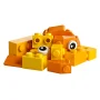 Assortment of yellow and orange LEGO bricks with white eyes, forming colorful creatures on white background Assortment of yellow and orange LEGO bricks with white eyes, forming colorful creatures on white background