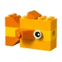 Small orange LEGO fish with round white and black eye, built with yellow and orange bricks Small orange LEGO fish with round white and black eye, built with yellow and orange bricks