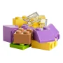 Colorful LEGO bricks stacked together: yellow, purple, brown, green and transparent pieces on white background Colorful LEGO bricks stacked together: yellow, purple, brown, green and transparent pieces on white background