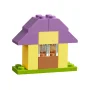 Small LEGO house with purple roof, yellow walls, transparent window and green base Small LEGO house with purple roof, yellow walls, transparent window and green base