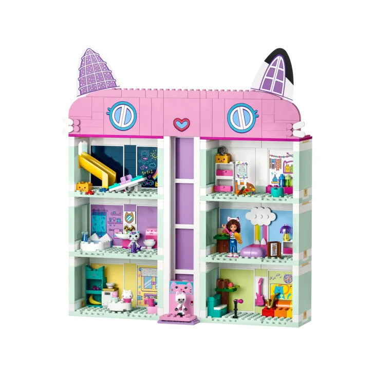 Casa LEGO rosa y blanca de 3 pisos con tejado violeta en forma de orejas de gato, interior amueblado con personajes y accesorios