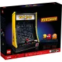 Caja LEGO mostrando máquina arcade PAC-MAN amarilla y negra con pantalla de juego y figuras PAC-MAN y fantasmas coloridos