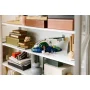 Astronave Firespray LEGO esposta su scaffale bianco con libri e oggetti decorativi in ambiente domestico moderno