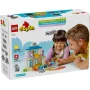 Scatola LEGO DUPLO che mostra papà e figlia che giocano con ambulatorio medico costruito, figure di dottore e paziente